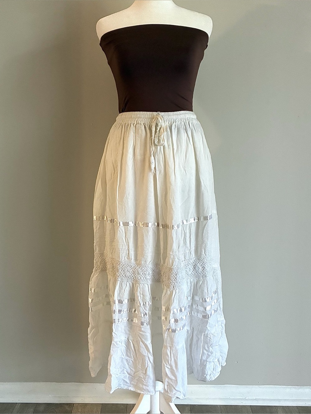 White flowy midi skirt with elastic waist band & string tie front. One Size